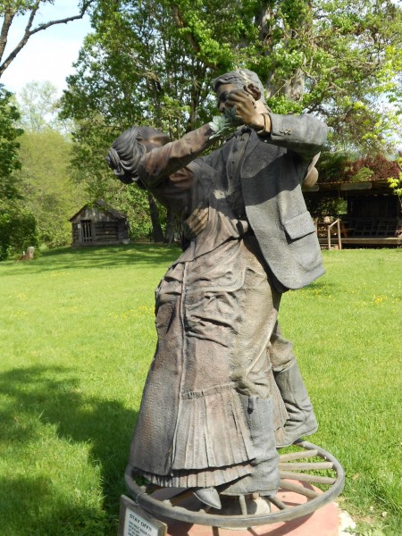 A bronze sculpture capturing the pioneer spirit, located in the town park