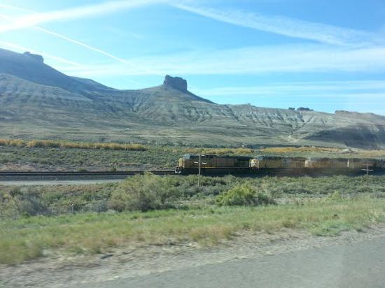 Freight train thundering across the Wyoming plains