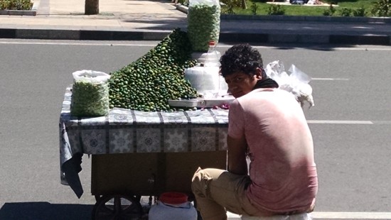 Street vendor in Tehran selling green almonds, Abi loves these!